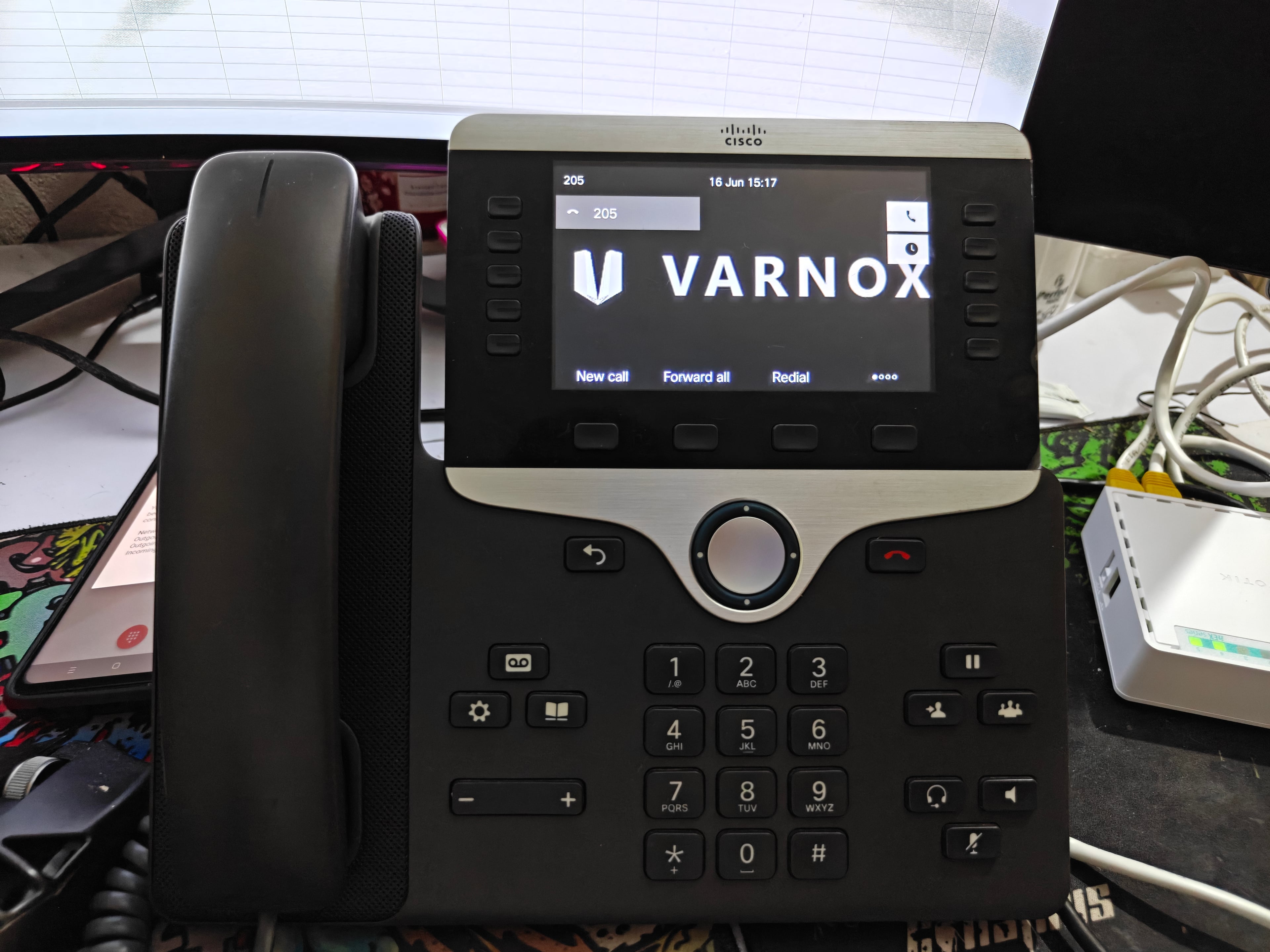 Cisco CP-8811 on desk — production extension